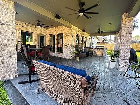 Covered backyard patio with seating