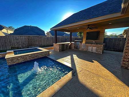 Backyard pool with outdoor kitchen