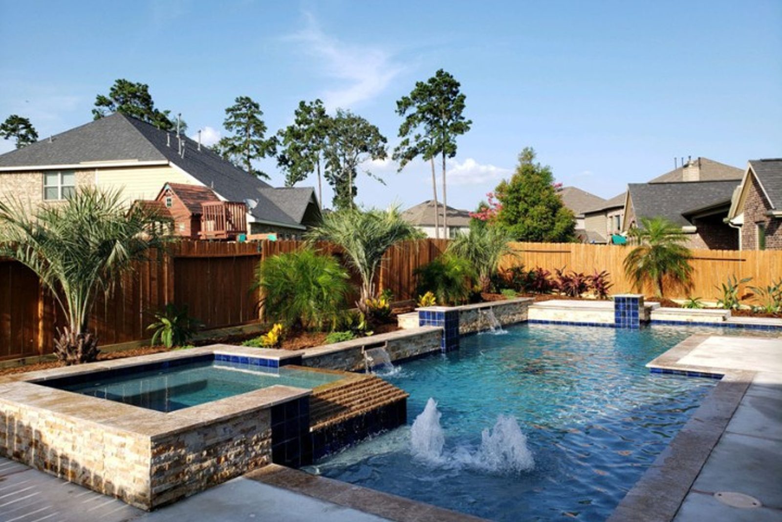 Modern pool upgrade with integrated spa and tropical elements