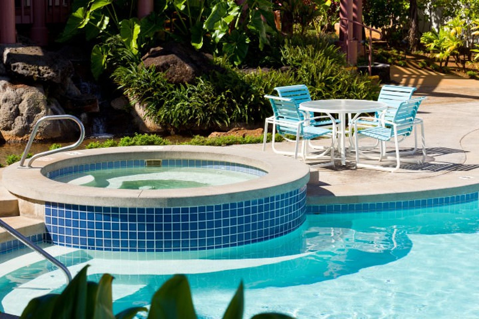 Custom pool spa landscape integration with outdoor seating