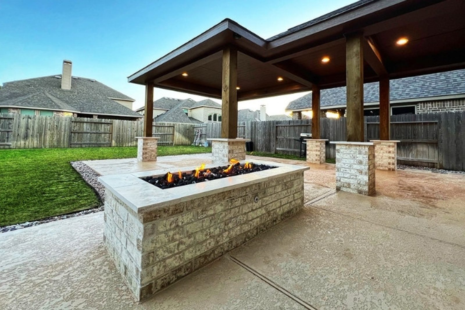 Modern rectangular outdoor fire pit designed for a spacious backyard patio