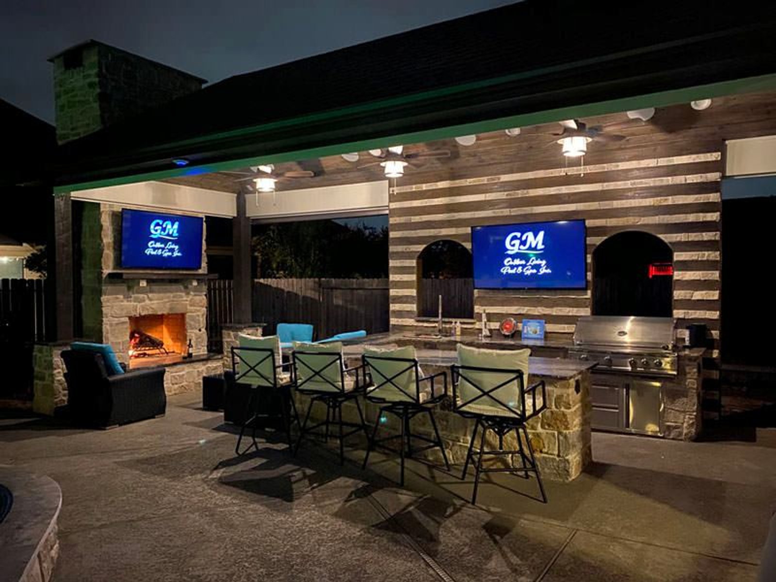 Houston patio kitchen with stone countertops and stainless steel appliances