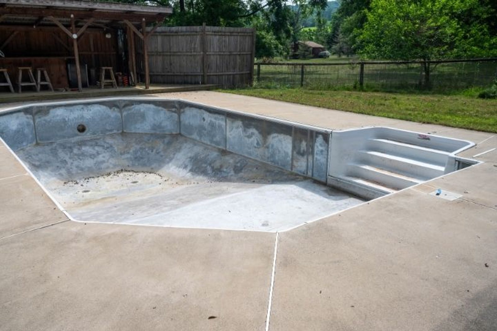 Empty swimming pool prepared for resurfacing and a new interior finish