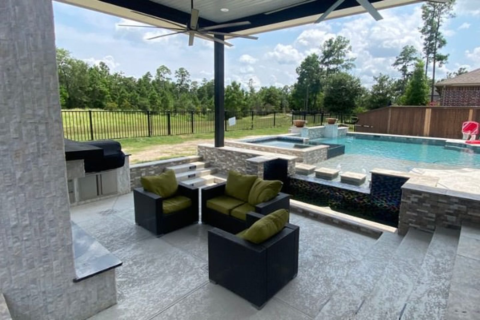 Lounge area by the pool accent with stylish seating and cohesive landscaping