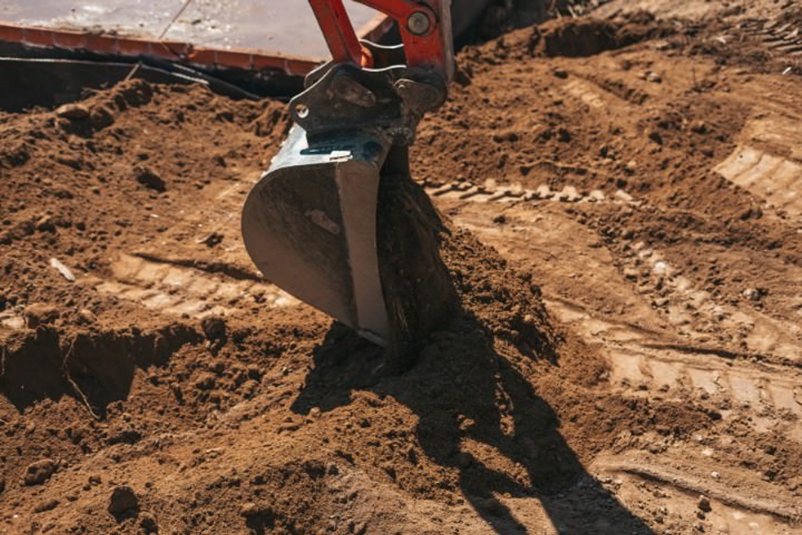 Pool excavation stage showing soil conditions in Houston that impact build timeline