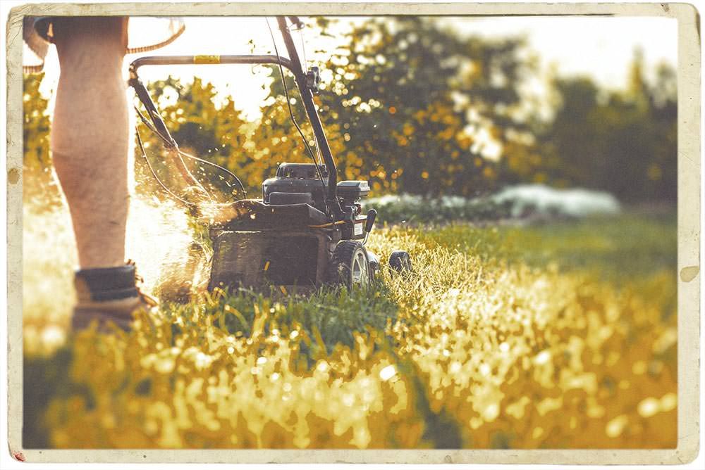 Early days of GM Landscaping founder cutting grass, symbolizing the company's origins