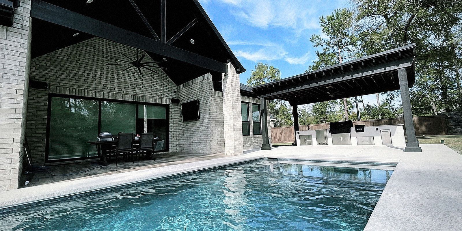 Outdoor kitchen and pool in Houston