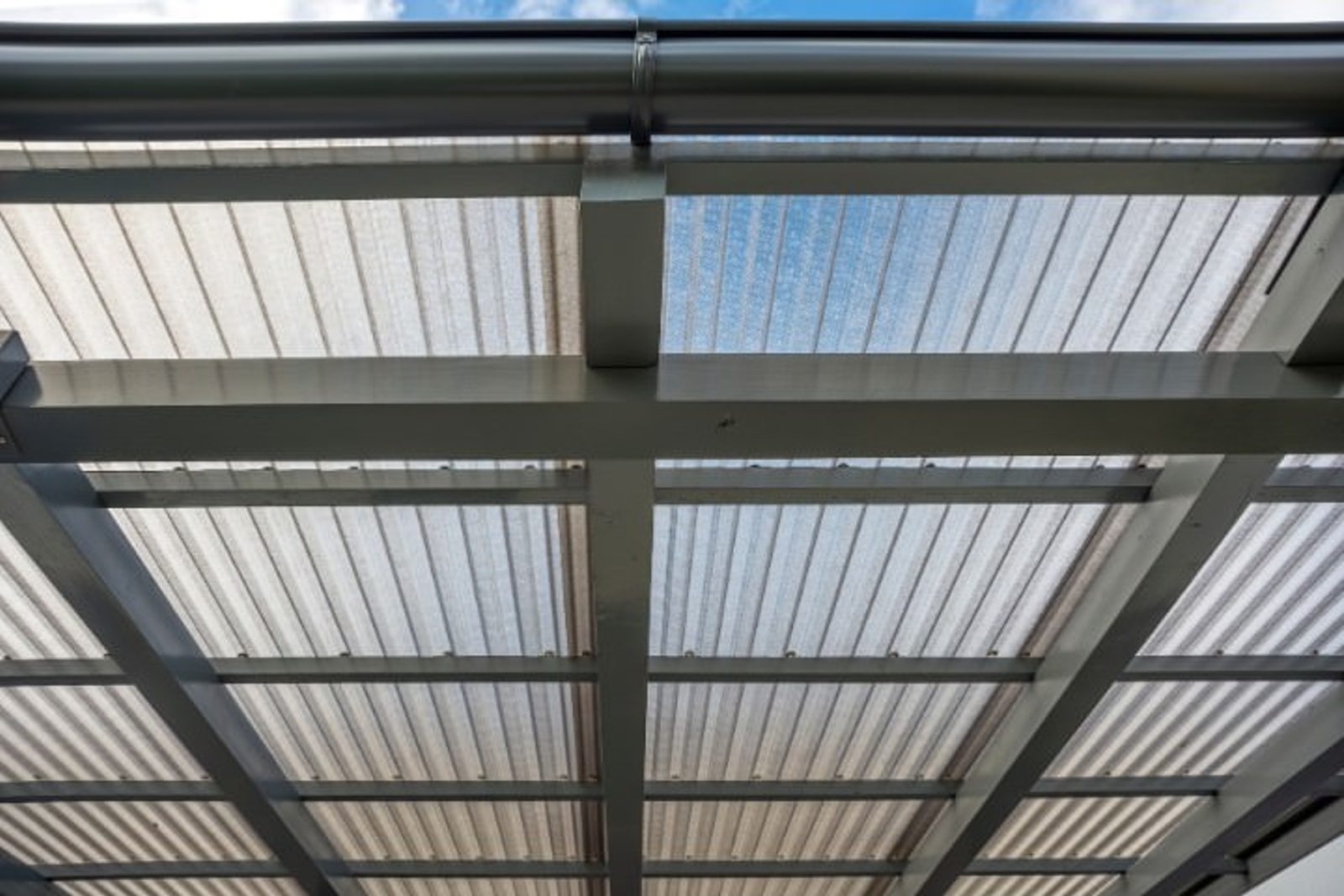 Polycarbonate patio roof allowing natural light while providing UV protection