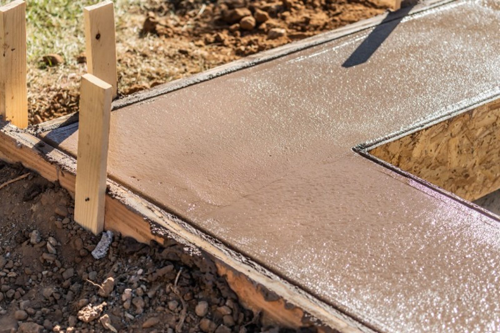 Pool coping construction in progress with wood framing, high-quality materials