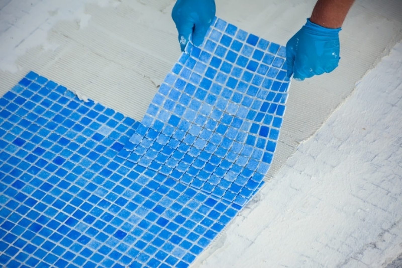 Pool tile installation for a custom swimming pool project in Conroe Texas