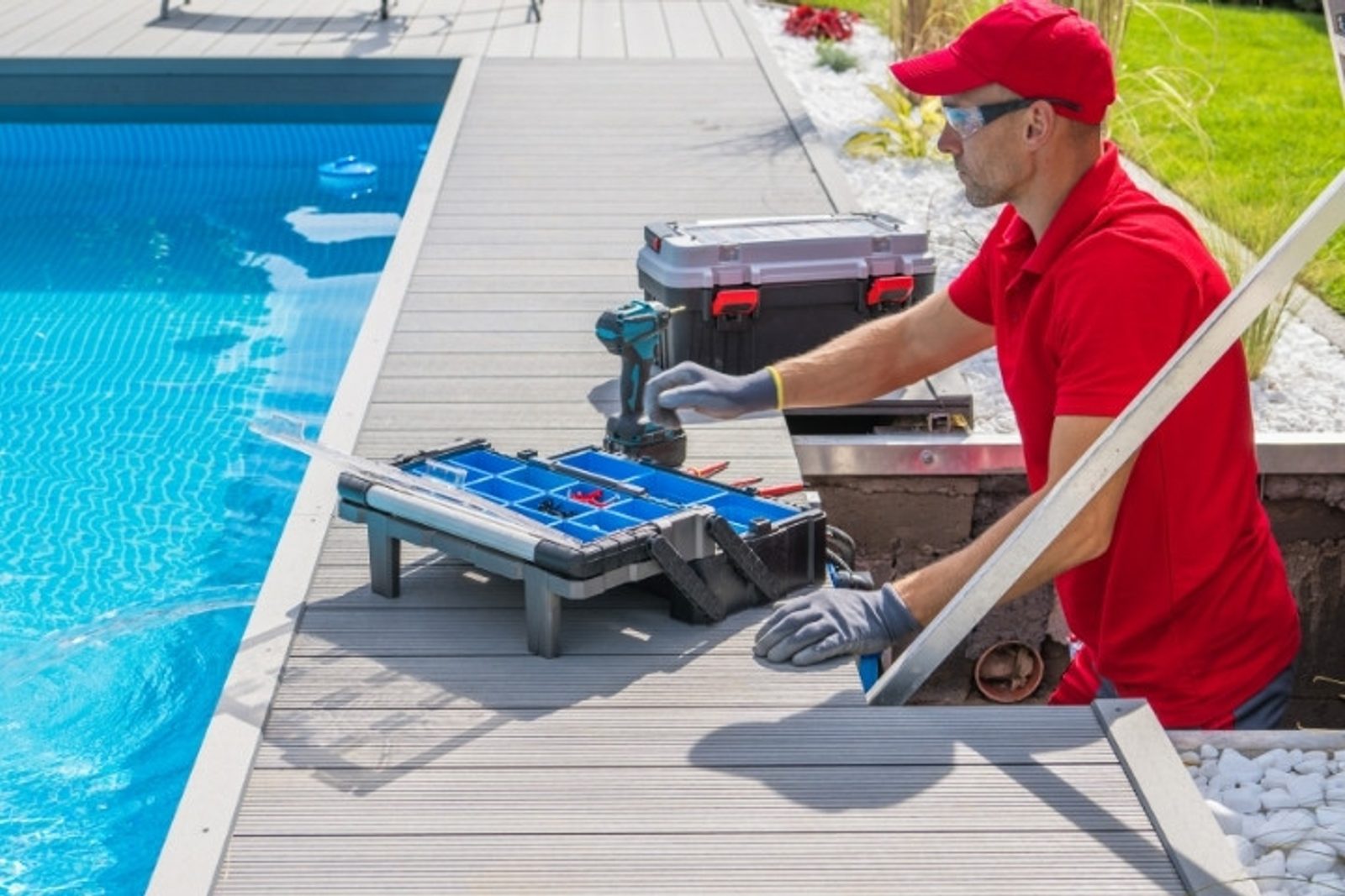 Pool professional maintaining equipment residential pool
