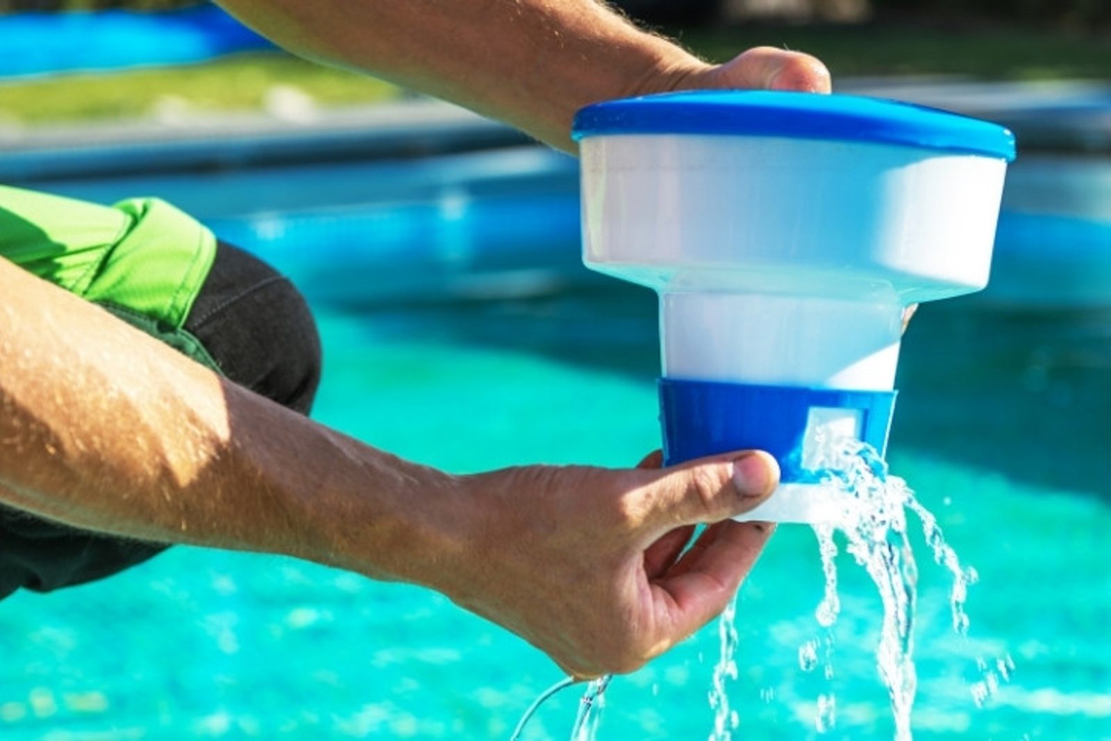 Technician balancing pool water chemistry levels