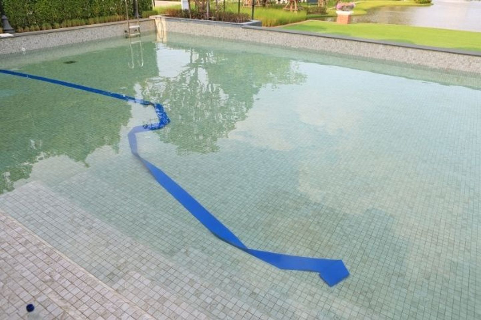 Draining a Houston swimming pool after a rainstorm