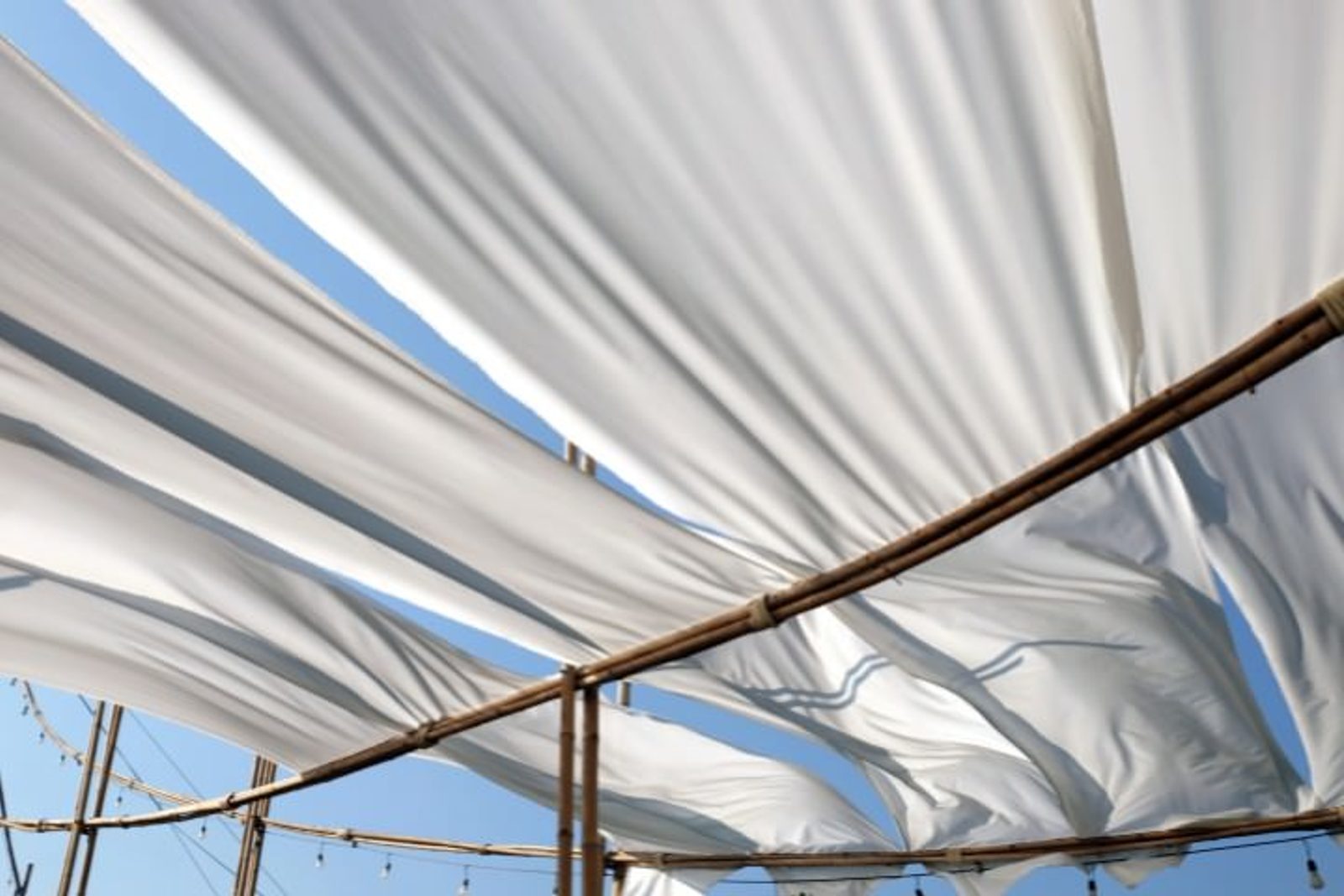 Fabric shade cover providing seasonal protection for Houston patios