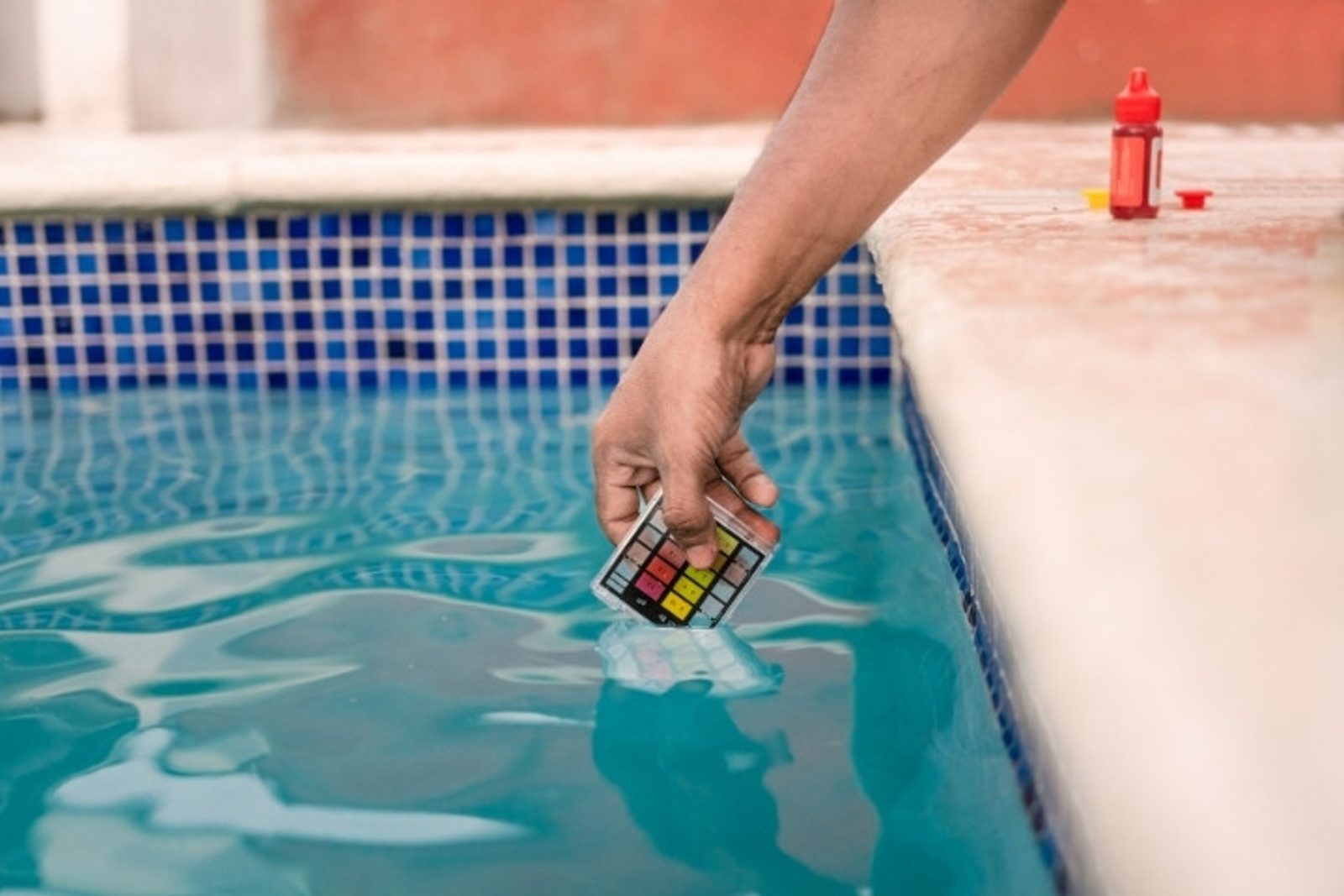 Pool water test checking for chlorine levels and water pH
