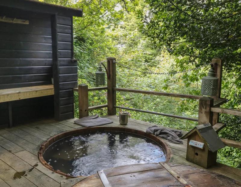Outdoor hot tub in a treehouse