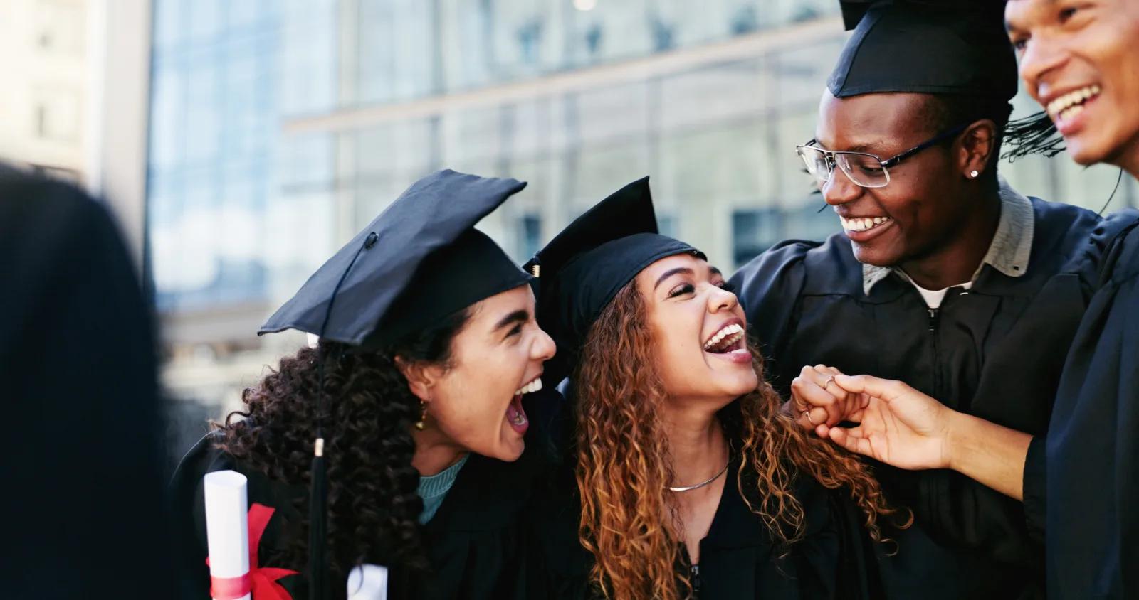 Graduates celebrating together at commencement.