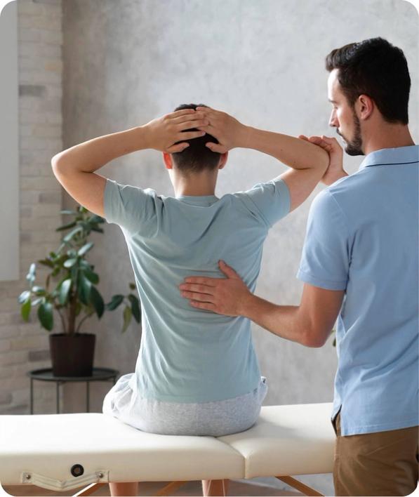 Chiropractor examining a patient's back