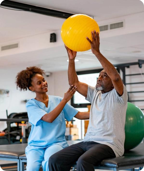 Patient lifting an exercise ball