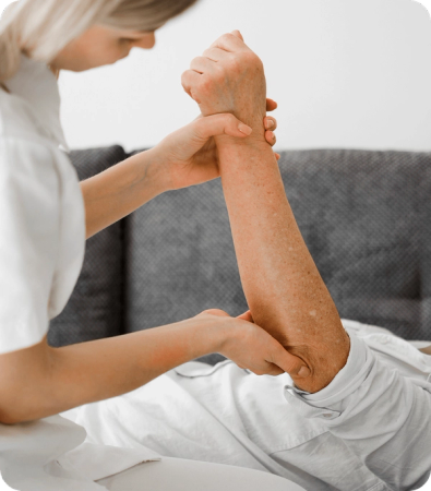 Chiropractor inspecting a patient's arm