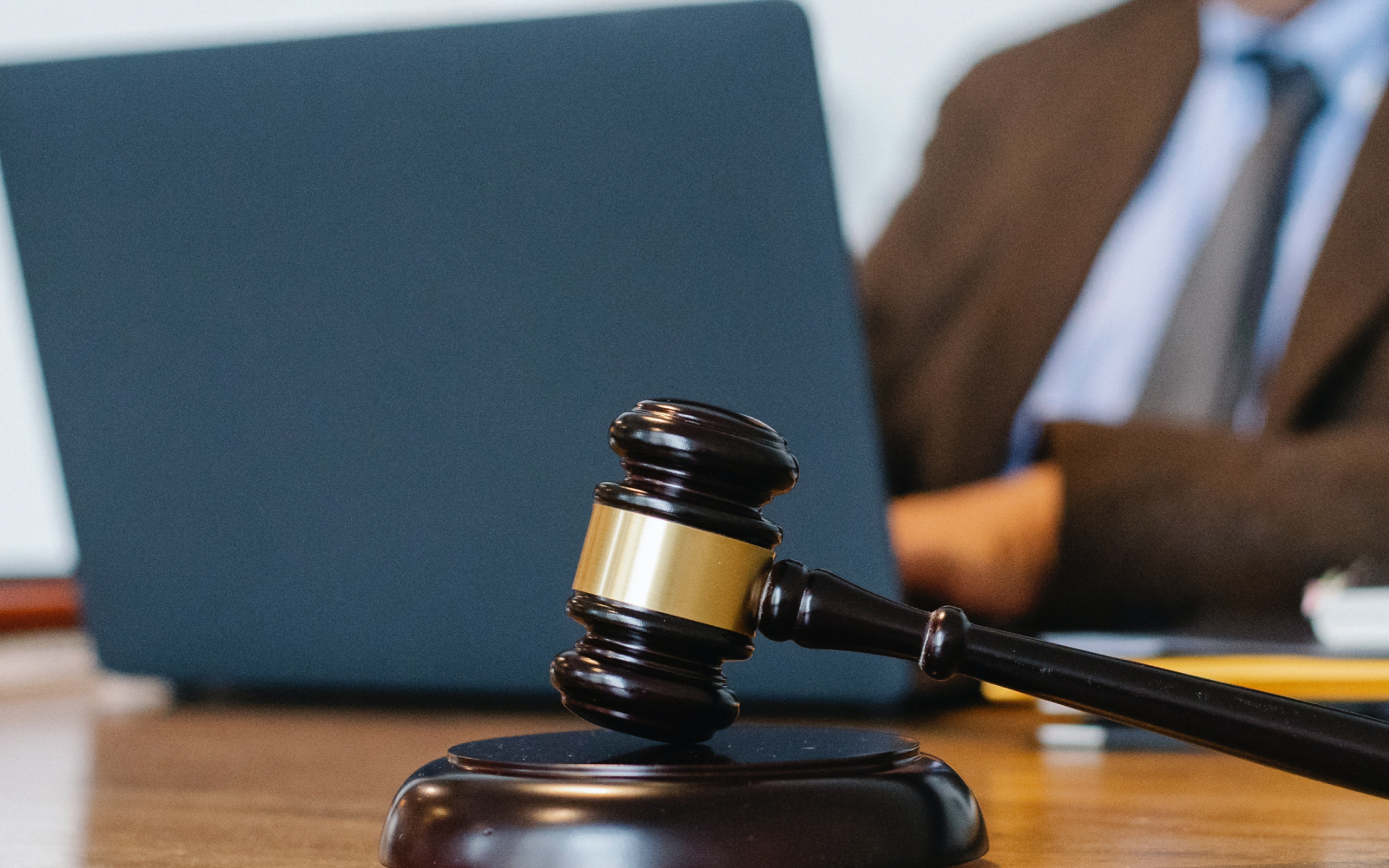 Judge working on laptop in office