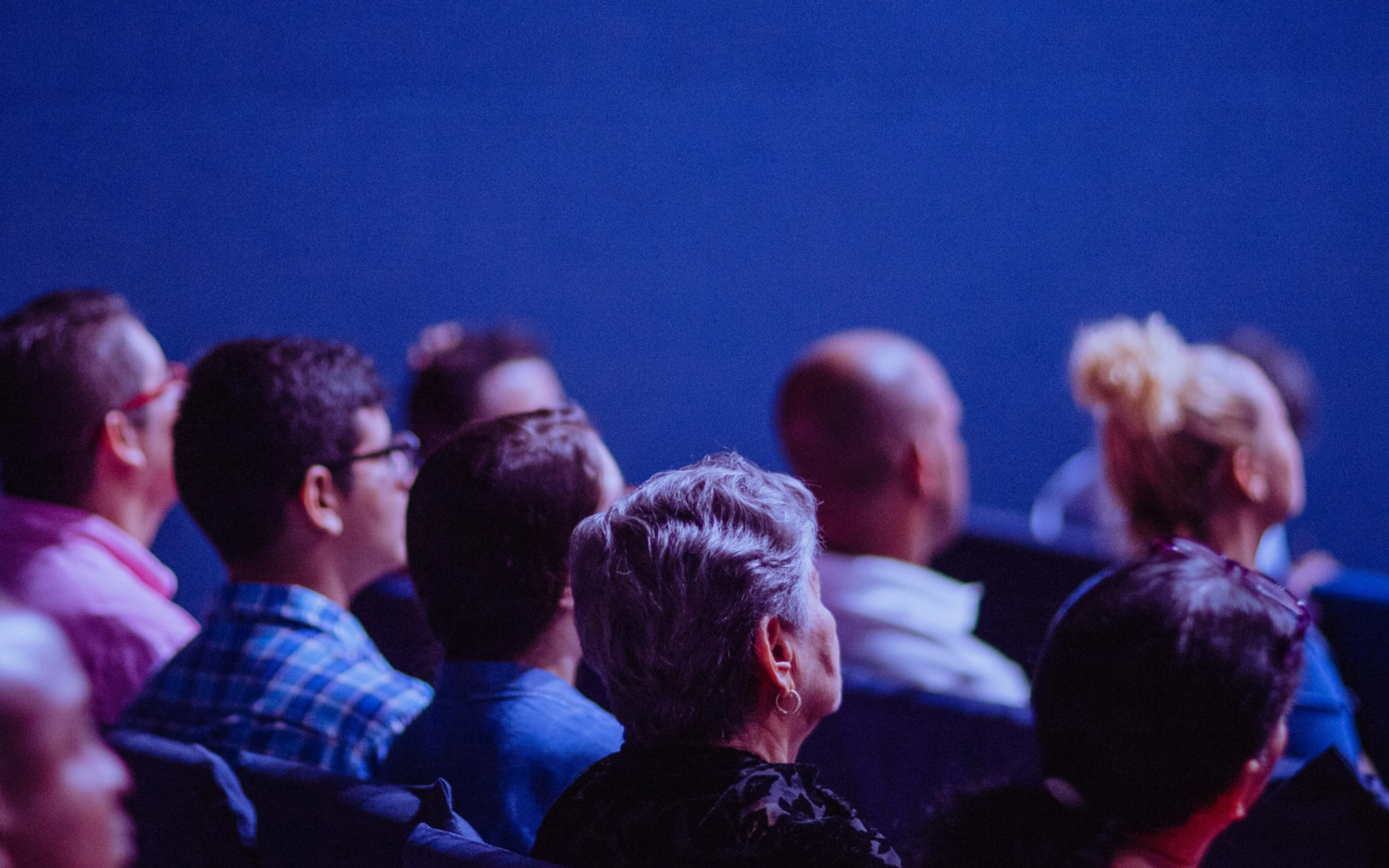 People Sitting on Gang Chairs

