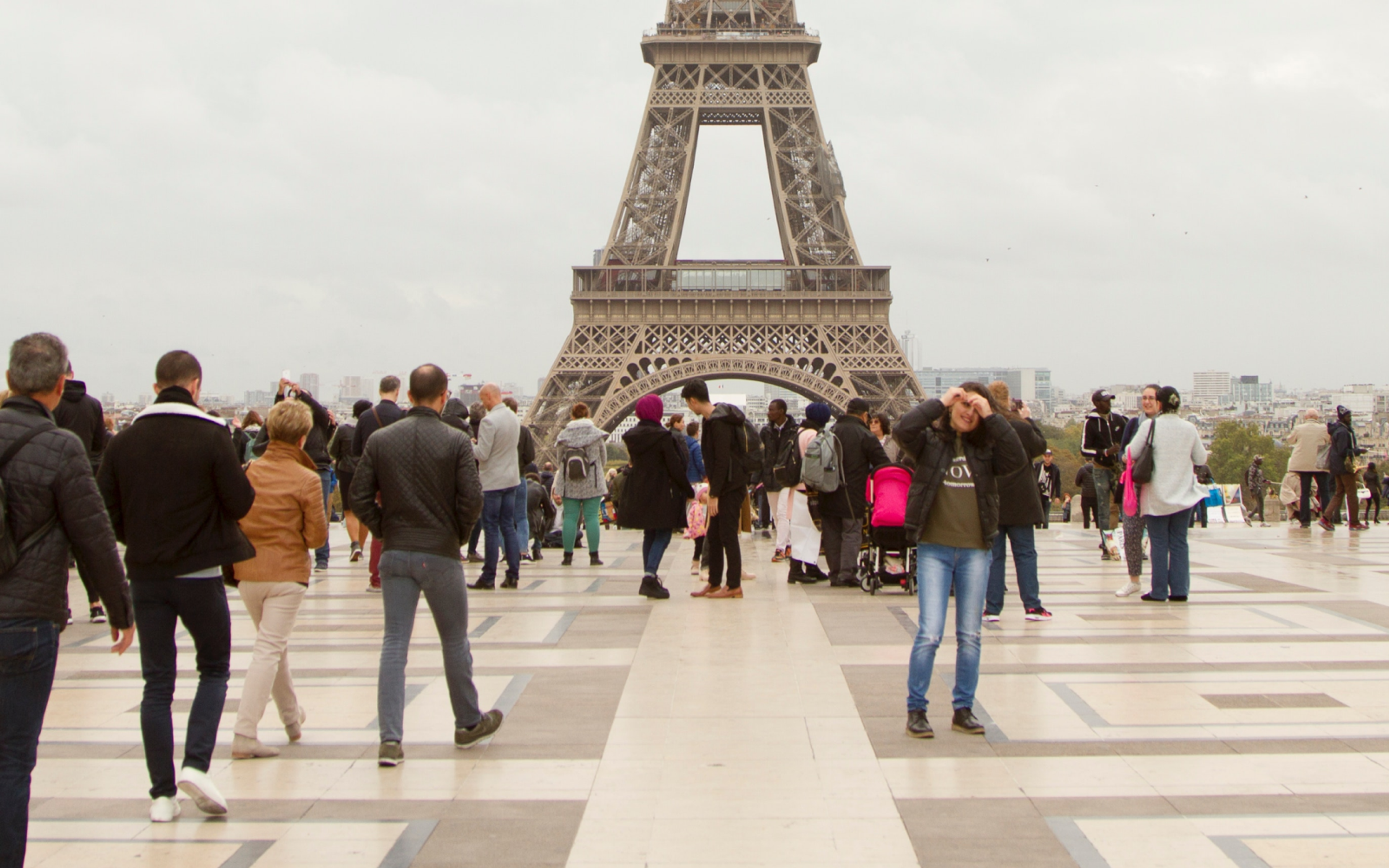 People Walking on the Street near Eiffel Tower