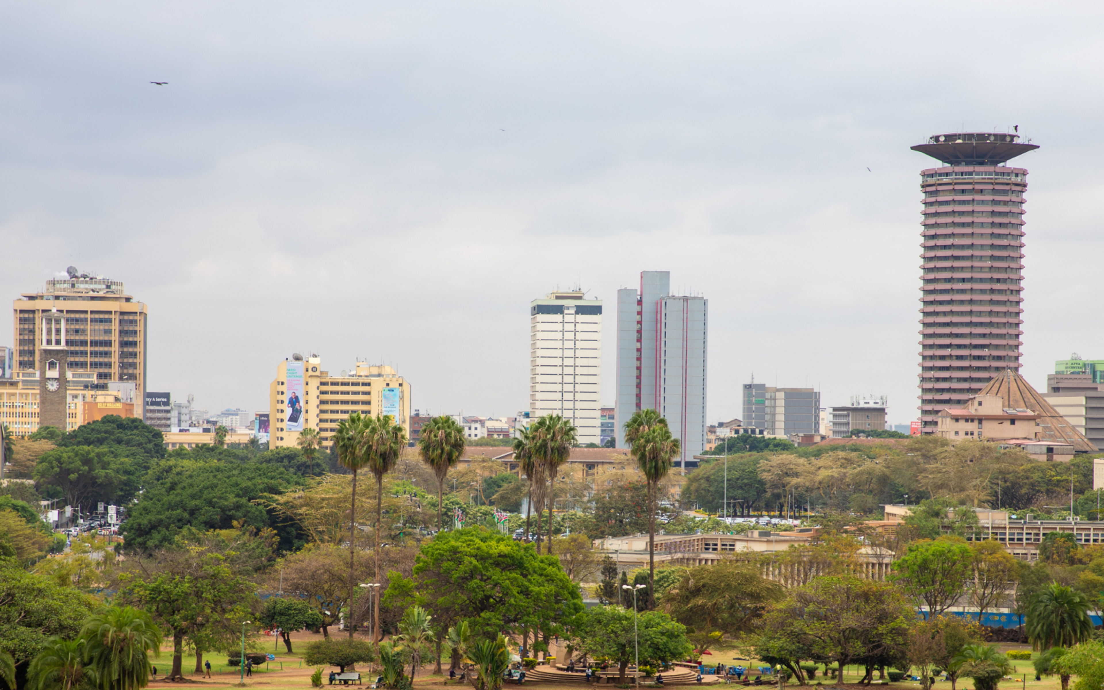 White Wooden Table and Chairs Near Body of Water in Nairobi, Kenya