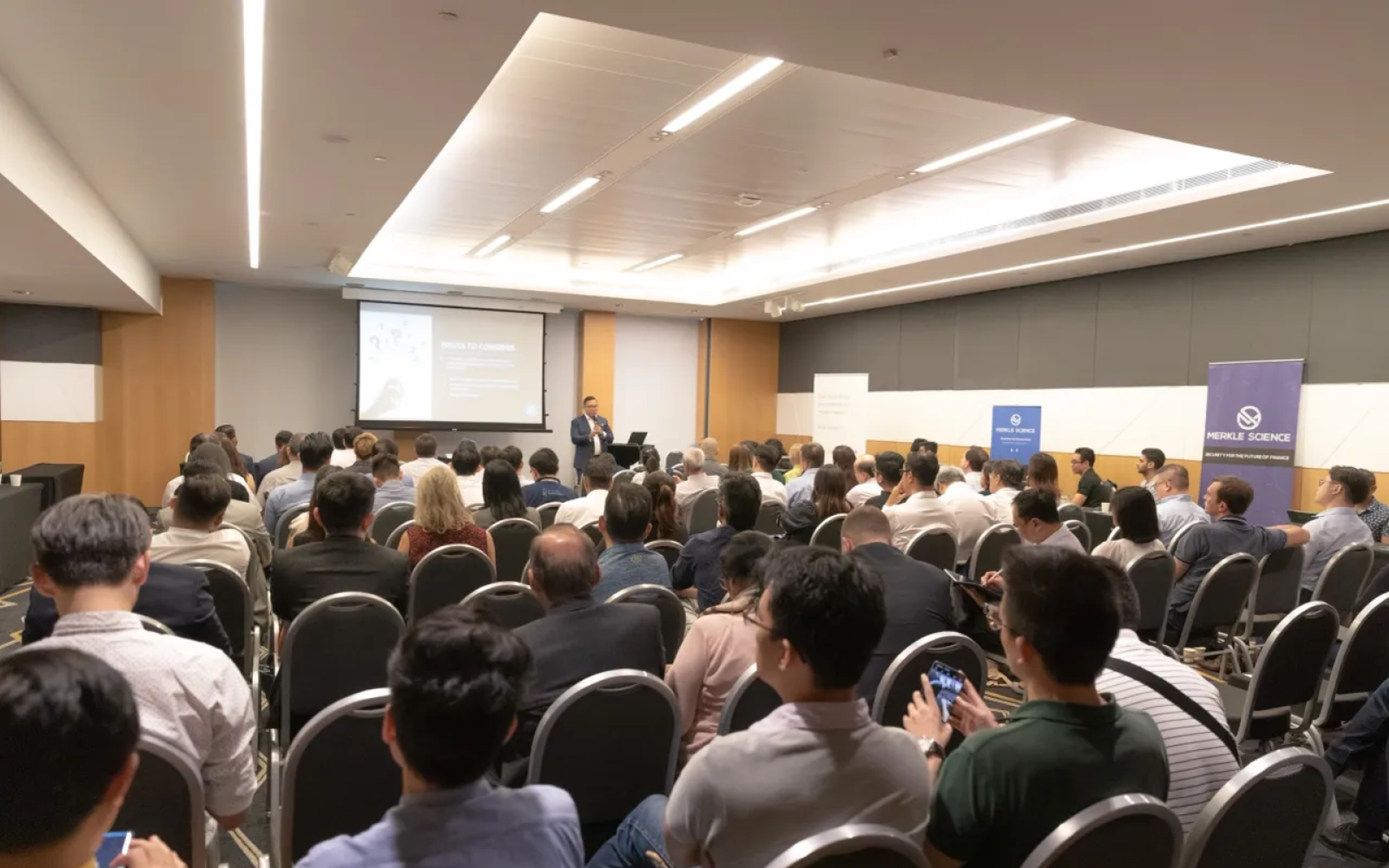 Group of people listening to a presentation for a group launch