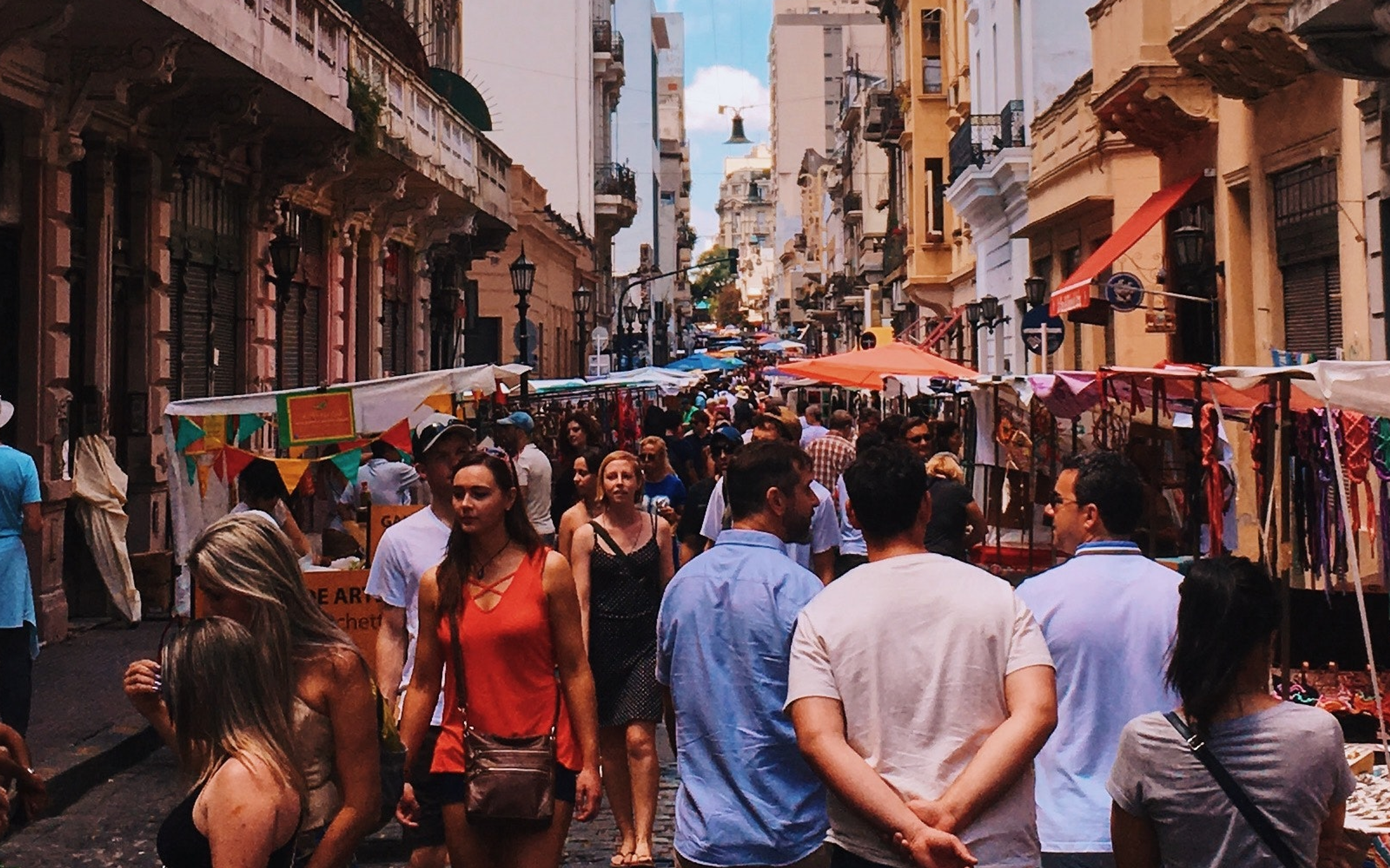 People Standing on Road Beside Market and High-rise Buildings in San Nicolas, CABA, Argentina