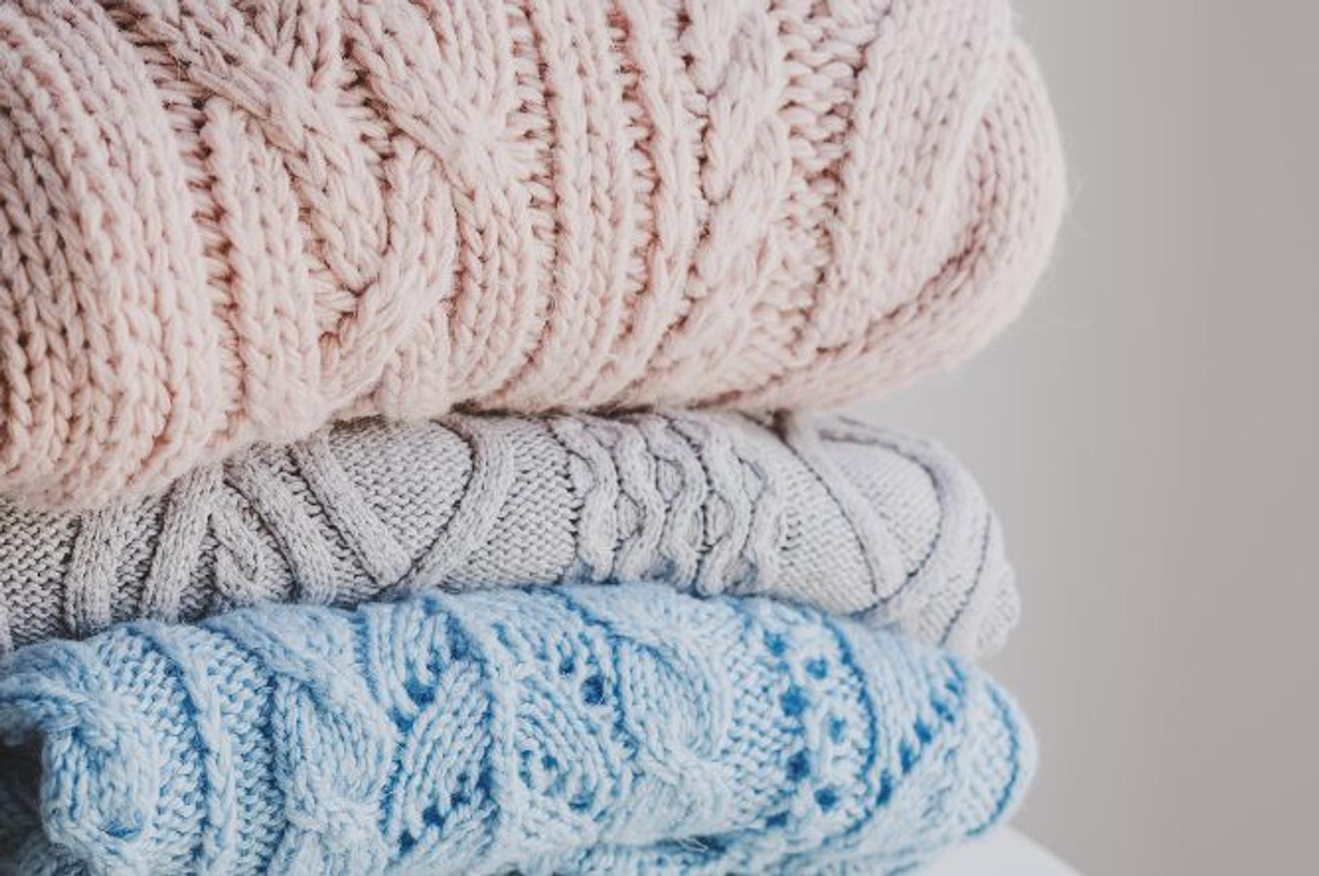 Examples of cable knit sweaters.