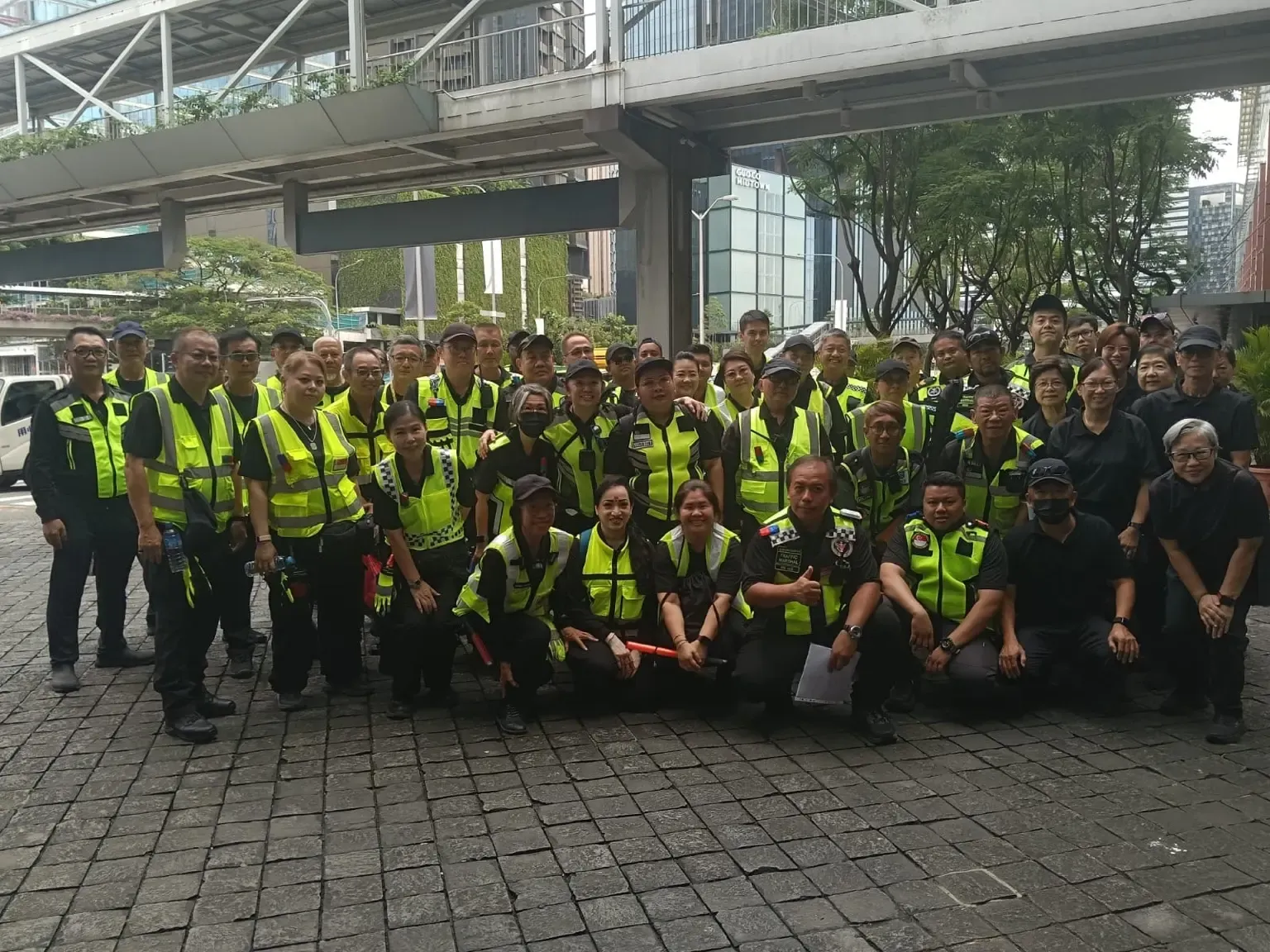SSIS officers gathered for a team photograph in high-visibility vests