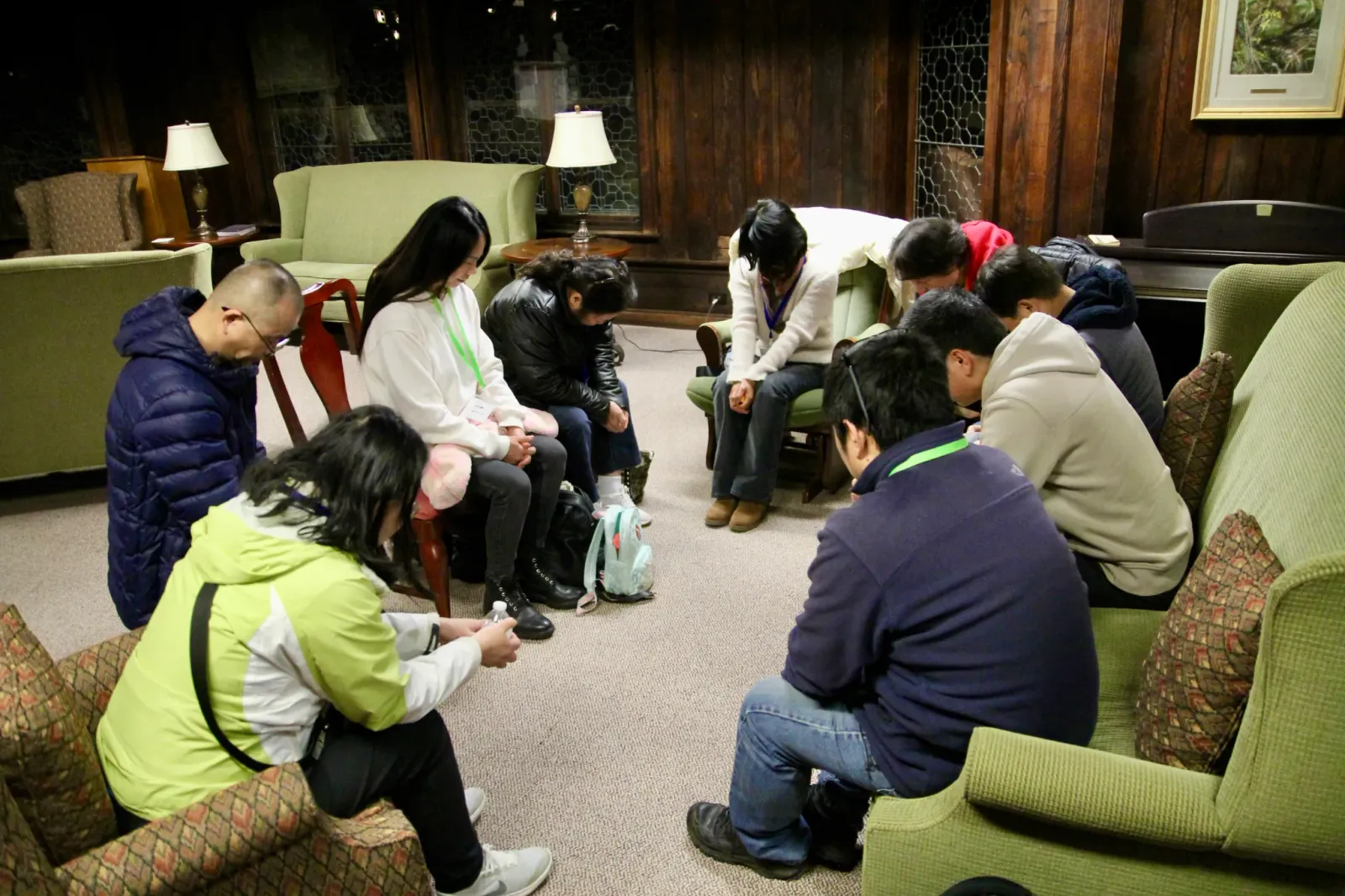 Church members praying together at retreat