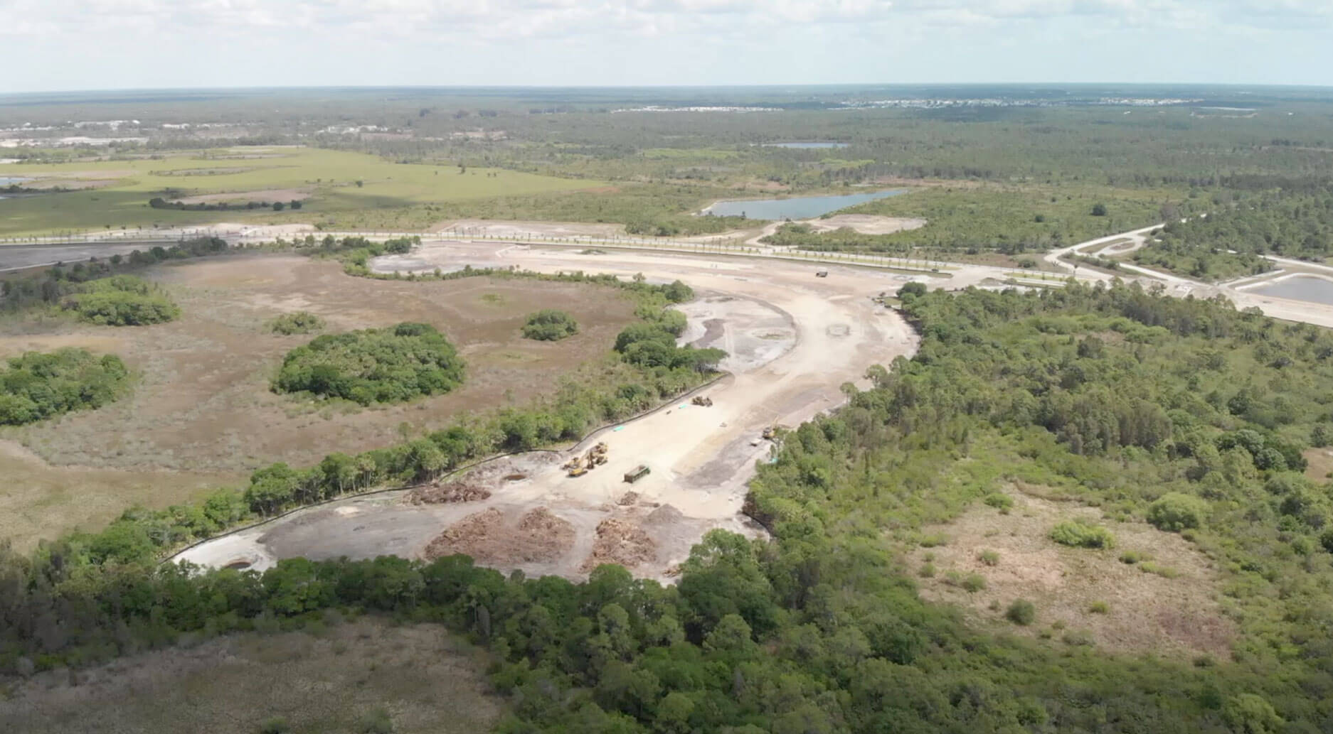 Aerial view of community land development near Florida preserves