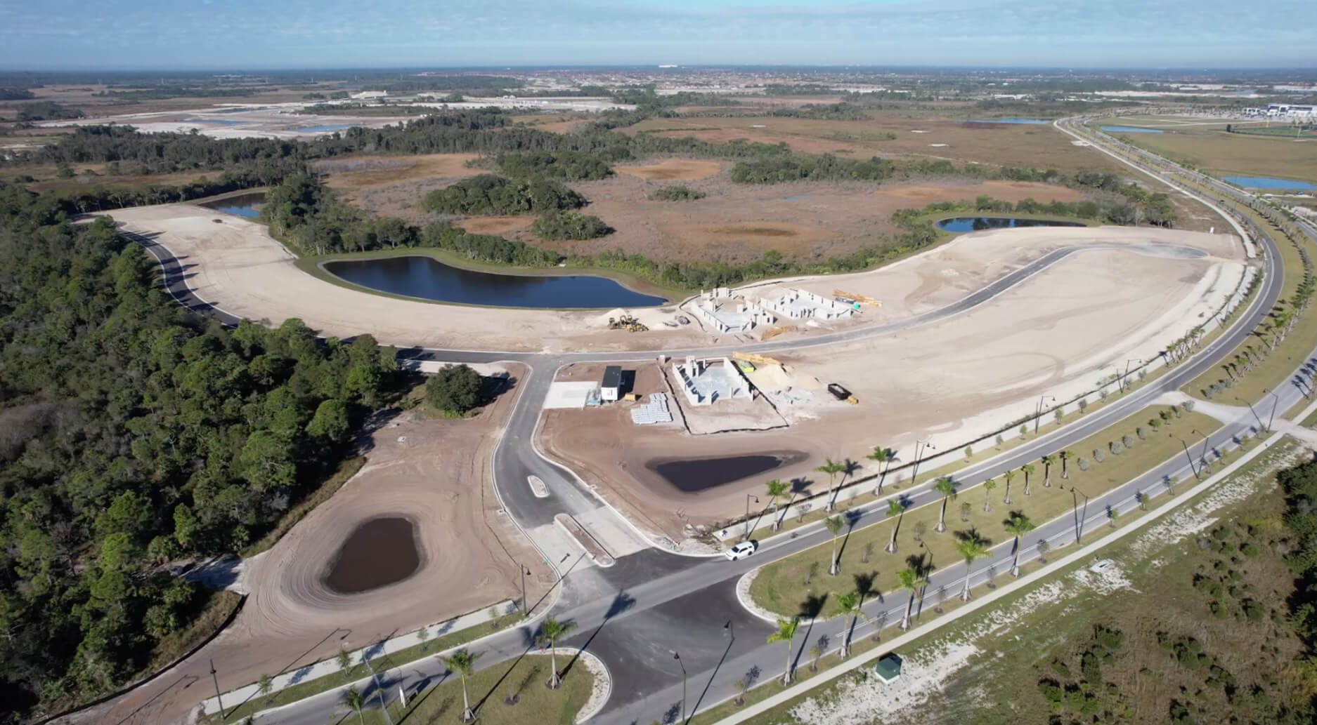 Drone view of Sam Rodgers community with ponds and new streets