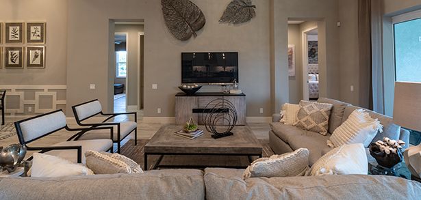Neutral-toned great room with sectional in Sam Rodgers home