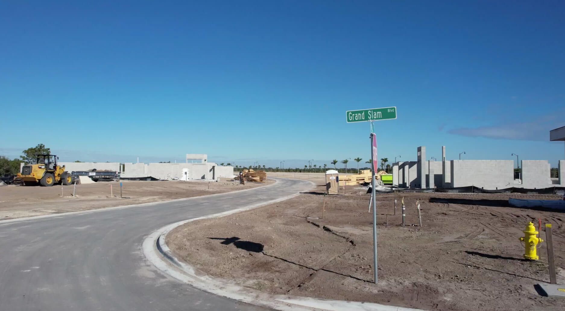 Grand Slam Blvd street sign amid homes under construction