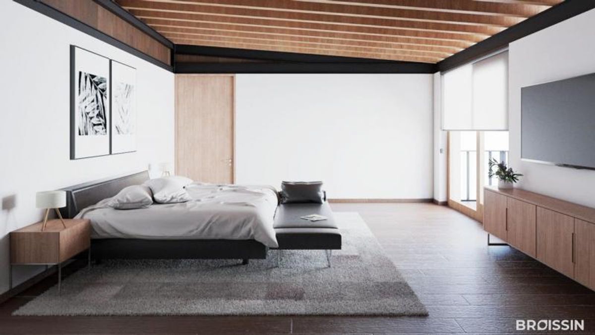 Recámara con techo de vigas de madera, cama sobre tapete gris y mueble para televisión