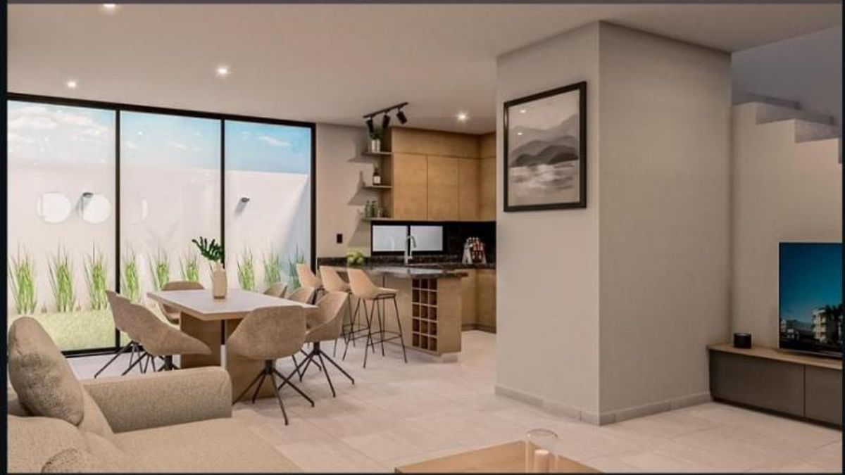 Sala y comedor con ventanales de piso a techo junto a cocina con barra