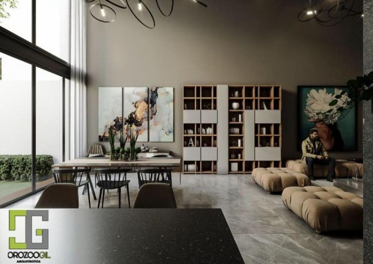Comedor y sala con grandes ventanales, librero de madera, cuadros decorativos y sillones modulares
