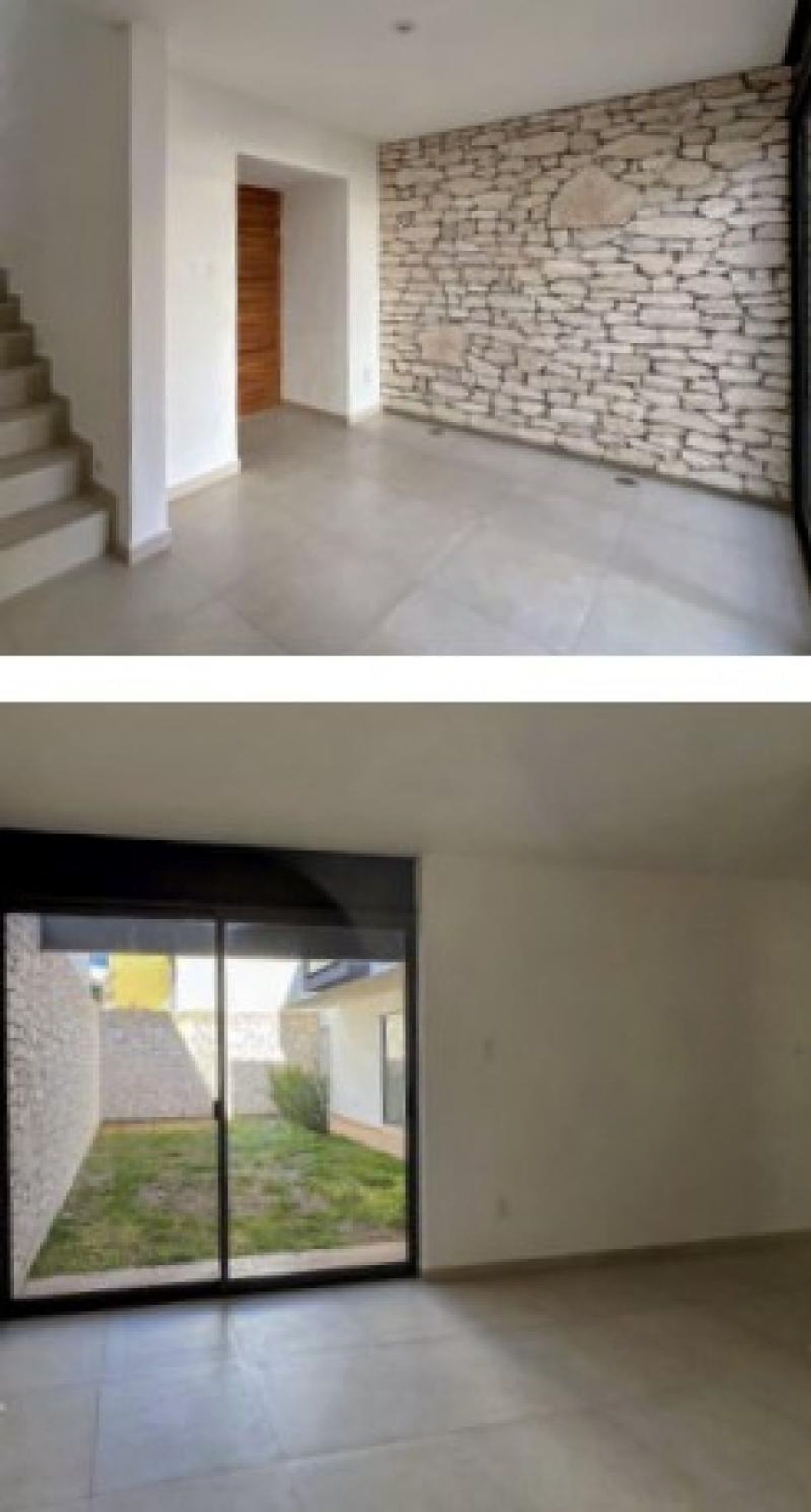 Sala vacía con muro de piedra, pisos de cerámica clara y ventanal al jardín
