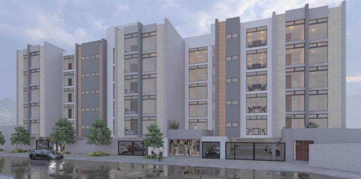 Fachada de edificio residencial en tonos grises con amplios ventanales, portones y árboles frontales