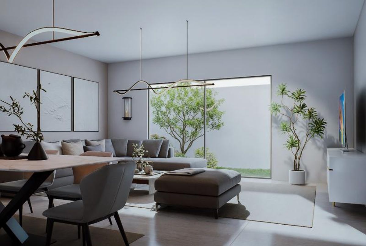 Sala moderna con sofá gris, otomana, lámparas colgantes y ventanal con vista al jardín