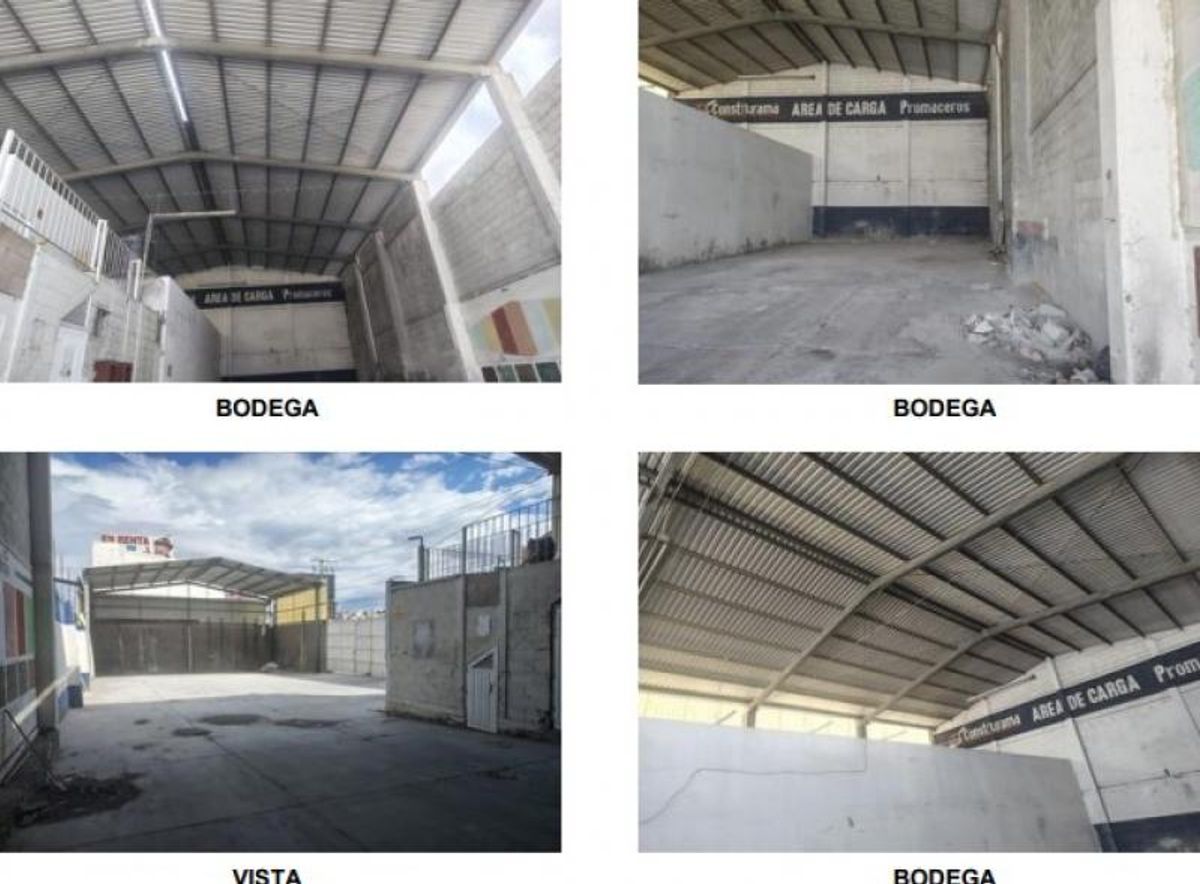 Bodega industrial con techo metálico alto, piso de concreto y patio exterior pavimentado