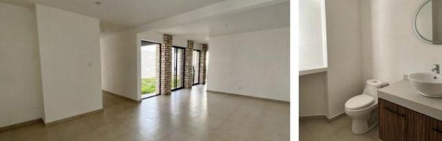 Sala con ventanales hacia el jardín y baño con inodoro y lavabo