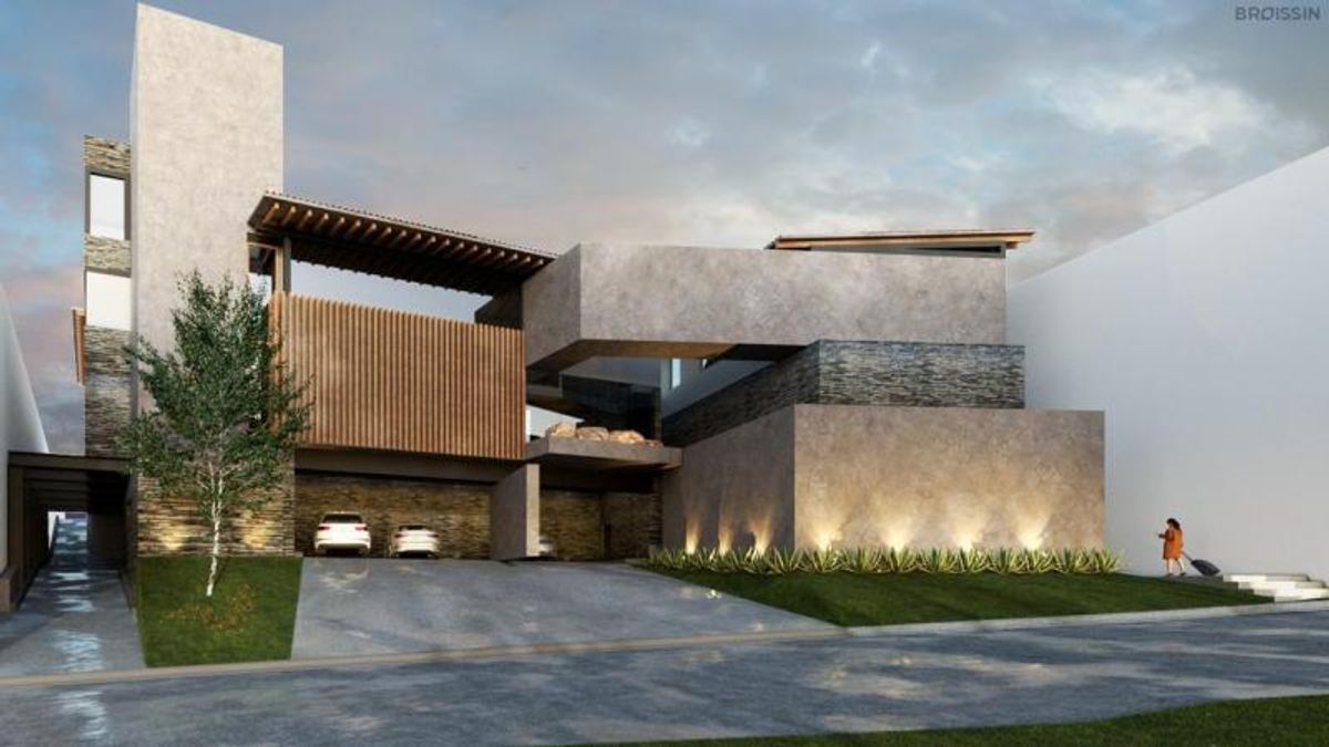 Fachada moderna de concreto y piedra con celosía de madera, cochera y jardín iluminado