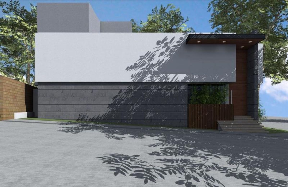 Fachada exterior con muros de piedra gris, nivel superior blanco y escalones de entrada