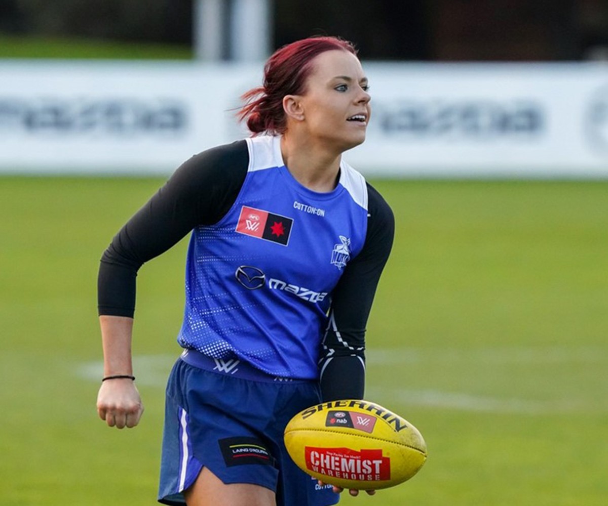 Bulk Nutrients x North Melbourne Football Club Partnership AFLW Player with a ball