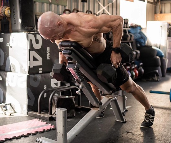 Bulk Nutrients Ambassador Bobby Dee pulling weights on a bench