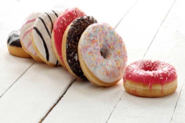 A plate of sugary, glazed donuts.